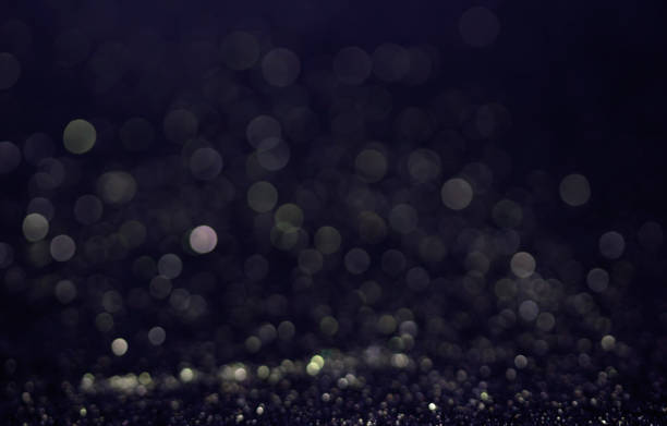 istock Bokeh glitter fly and lights on black 827015236