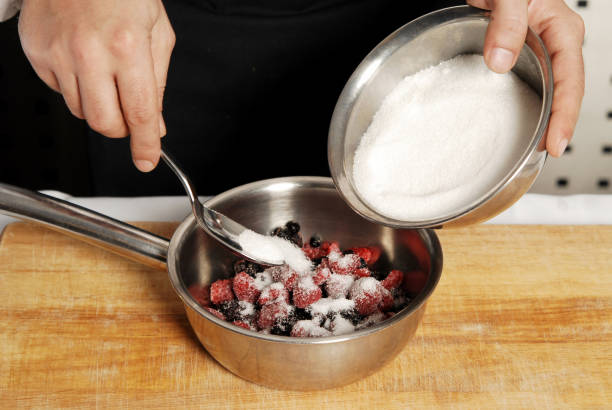 istock Berry fruits with sugar preparing 827022134