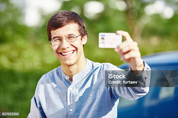 Guy With Driving License Stock Photo - Download Image Now - Driver's License, Showing, Driver - Occupation