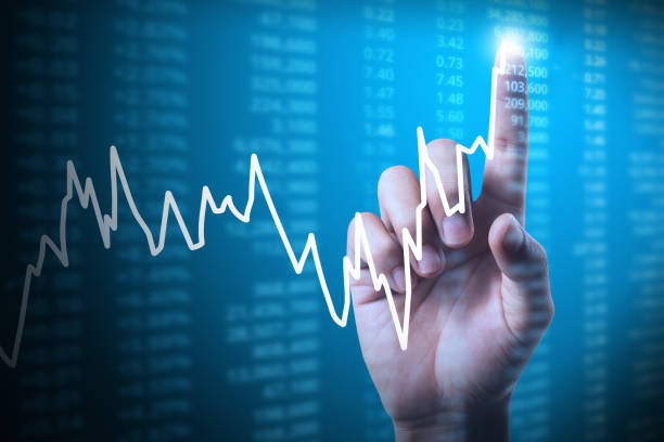 istock businessman with financial chart symbols coming from hand 827022566