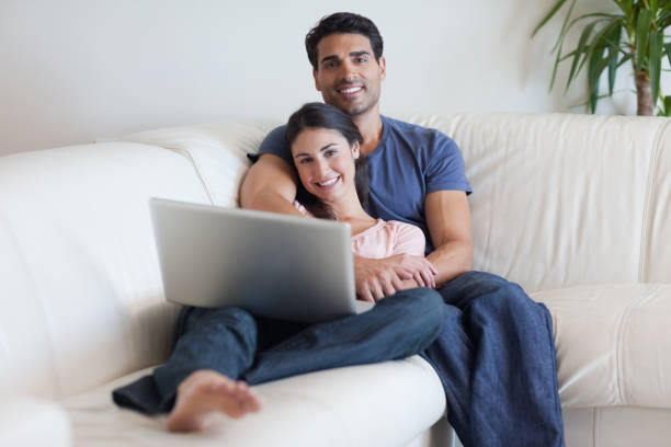istock Couple watching a movie with a laptop 827025708
