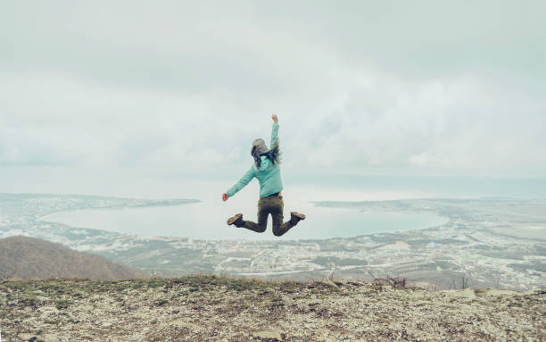 istock Happy jump outdoor. 827026198