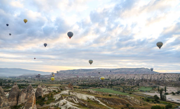 istock Hot Air Balloons in Cappadocia Valleys 827029354