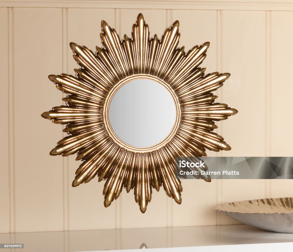 Wall Sun Mirror Wall Sun Mirror on an interior wall Mirror - Object Stock Photo