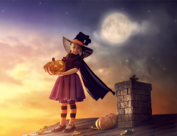 istock little witch outdoors 827043516