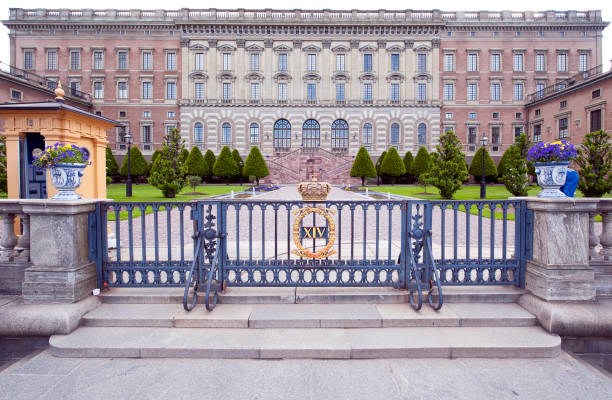 Royal Palace, Stockholm, Sweden. The Sentry box behind the railings with their royal crest in the grounds outside the exterior facade of the Royal Palace, Stockholm, Sweden