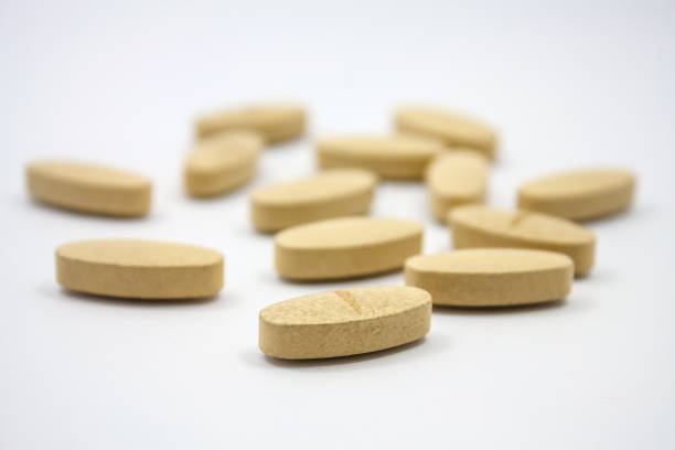 istock nutritional vitamin supplement pills on white background 827044534
