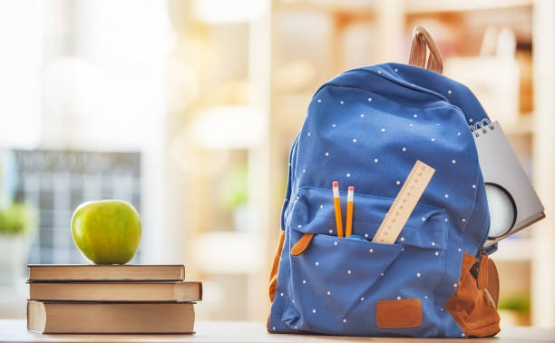 Apple, pile of books and pencils Back to school and happy time! Apple, pile of books and backpack on the desk at the elementary school. crayon drawing photos stock pictures, royalty-free photos & images