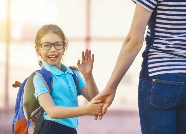 istock Parent and pupil go to school 827051890