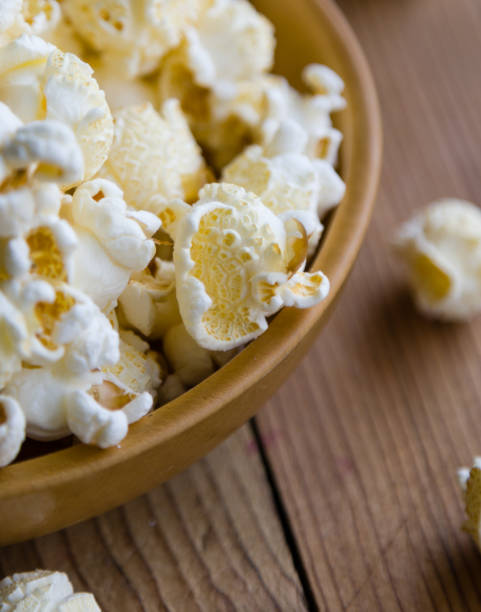 istock popcorn in wooden bowl 827051996