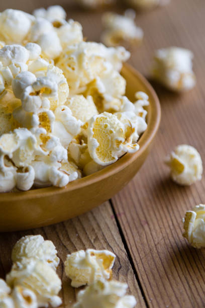 istock popcorn in wooden bowl 827052008
