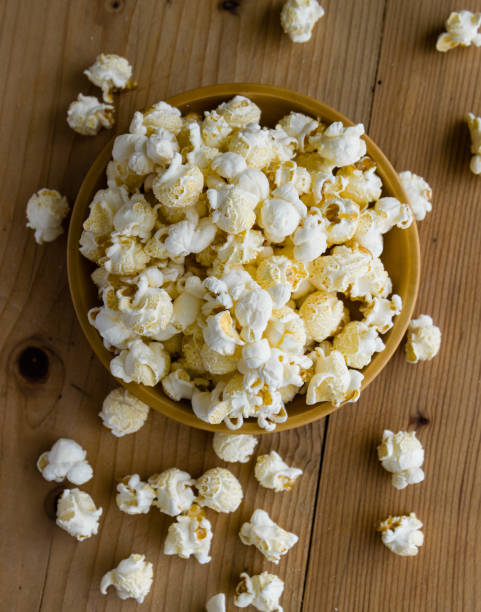 istock popcorn in wooden bowl 827052020