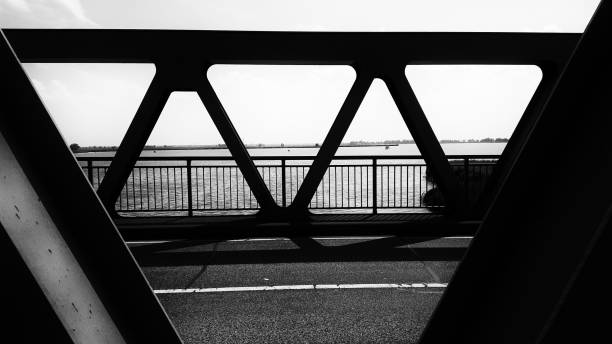 istock monochrome part of architecture - bridge steel construction with shadows 827054822