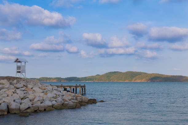 istock Lifeguard stand over sea coast skyline 827057830