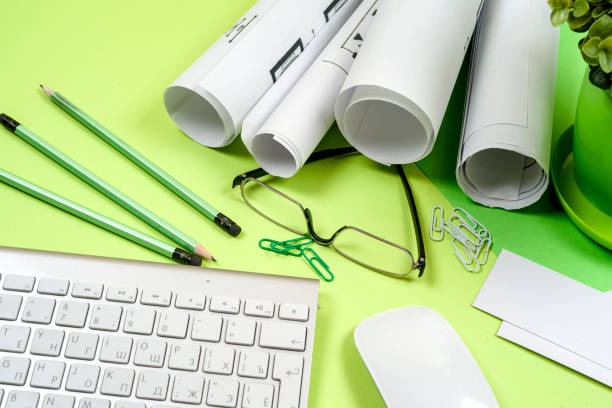 istock Workplace of architect - rolls and plans. 827058782