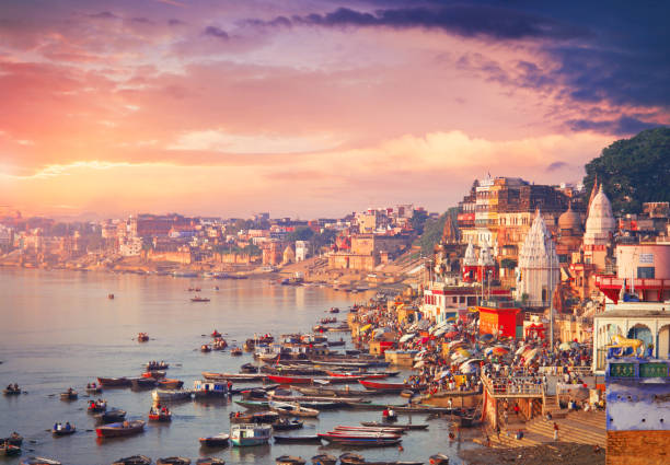 Holy town Varanasi and the river Ganges Holy town Varanasi and bank of the Ganges river with ghats hindu temple in india stock pictures, royalty-free photos & images