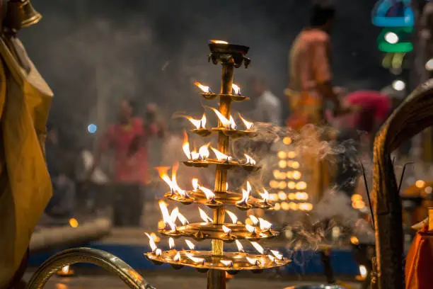 Candles used in performance of religious Ganga Aarti ritual fire puja at Dashashwamedh Ghat in Varanasi, Uttar Pradesh, India.