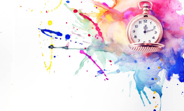 istock Pocket watch on a spilled paint 827074880