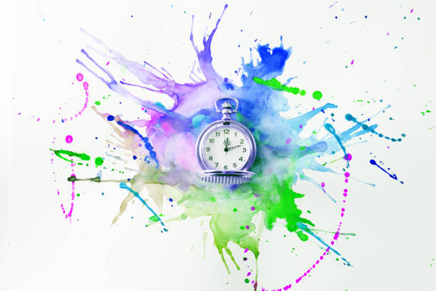 istock Pocket watch on a spilled paint 827074888