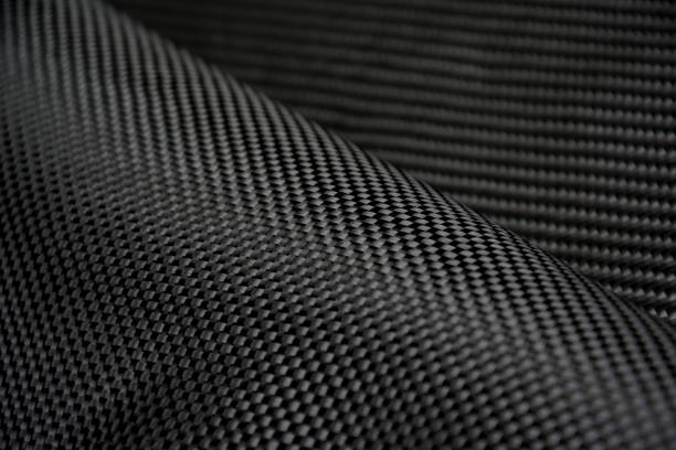 istock Black carbon fiber composite raw material close up background 827078144