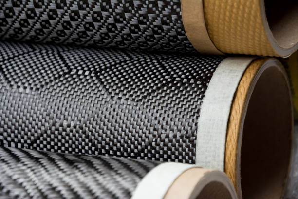 istock Black carbon fiber composite raw material close up background 827078306