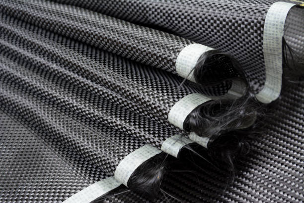 istock Black carbon fiber composite raw material close up background 827081040