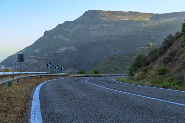 istock Road by the sea with blue sky 827084774