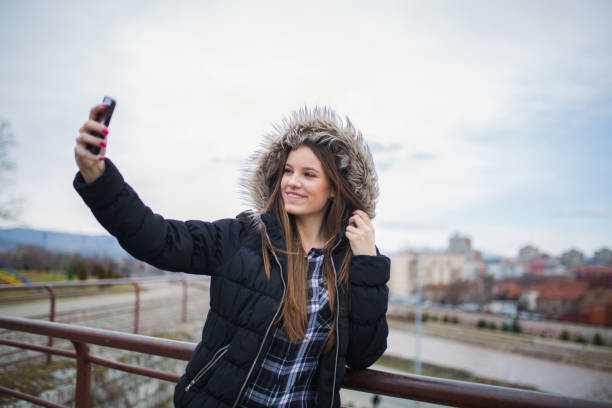istock Woman having fun with phone 827096038