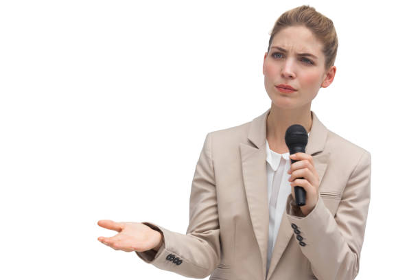 istock Frowning businesswoman holding microphone 827098568
