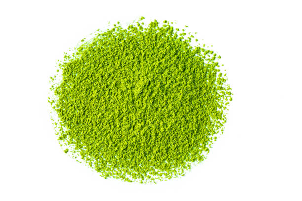 green matcha tea powder green matcha tea powder isolated on white background powder snow stock pictures, royalty-free photos & images