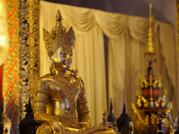 istock temple with golden Buddha 827106198