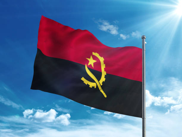 istock Angola flag waving in the blue sky 827116444