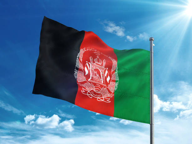 istock Afghanistan flag waving in the blue sky 827116448