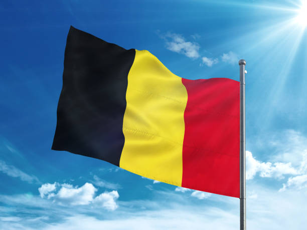 istock Belgium flag waving in the blue sky 827116480