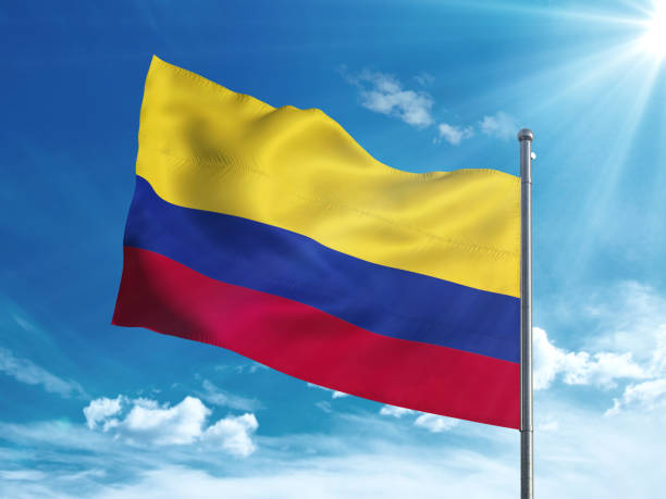 istock Colombia flag waving in the blue sky 827116506