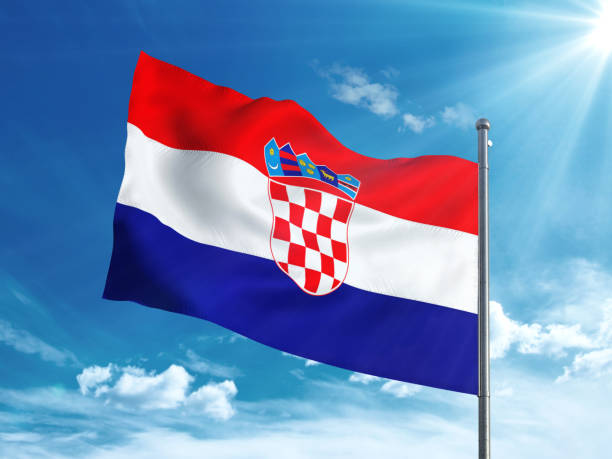 istock Croatia flag waving in the blue sky 827116508