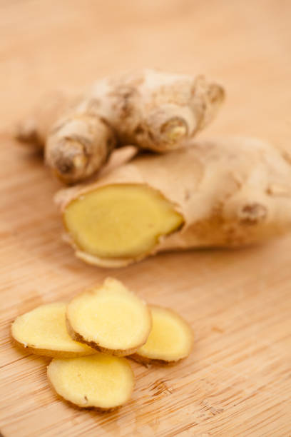 istock Slice of ginger and blurred piece of ginger 827118576