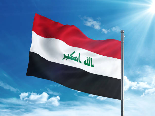 istock Iraq flag waving in the blue sky 827118624
