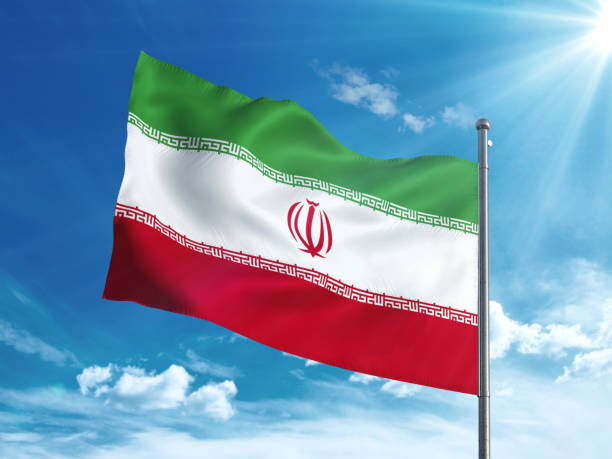 istock Iran flag waving in the blue sky 827118630