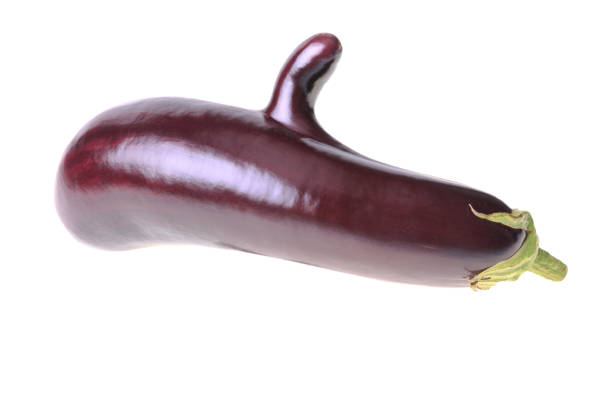 Italian eggplant with googly eyes on a white background