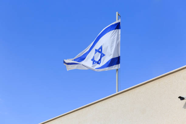 istock Flag of Israel ower a wall 827119402