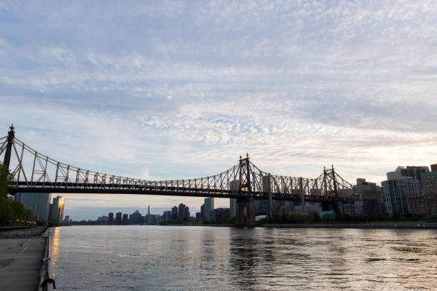istock Queensboro Bridge and the East River at dusk 827123546