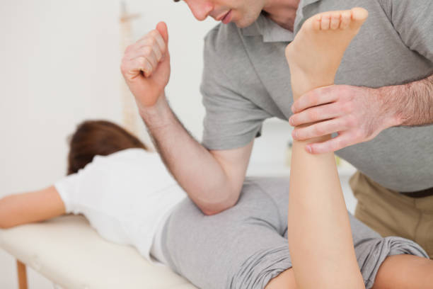istock Woman lying while being massaged by her doctor 827132914