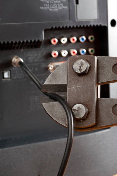 istock Cut the cable TV cord with hand and wire cutters 827144964