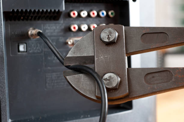 istock Cut the cable TV cord with hand and wire cutters 827144978