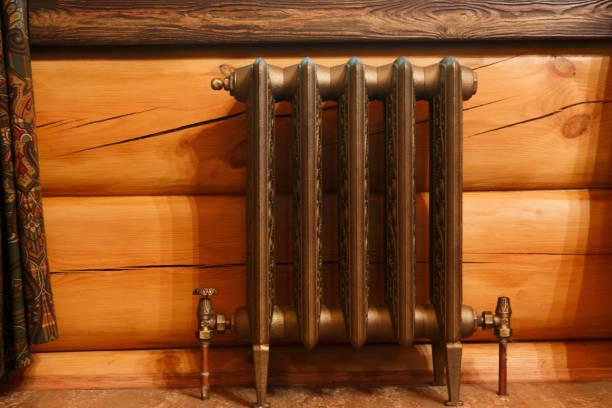 Cast iron retro design radiator in timber house
