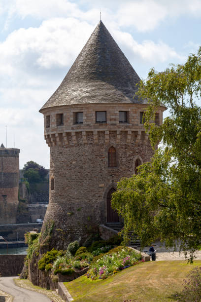 Brest, France - July 24 2017: The Tour Tanguy, Bastille de Quilbignon or Tour de la Motte Tanguy is a medieval tower on a rocky motte beside the Penfeld river in Brest, France. Probably built during the Breton War of Succession, it faces the château de Brest and is now accessed by a road off the square Pierre Péron, at one end of the pont de Recouvrance.
