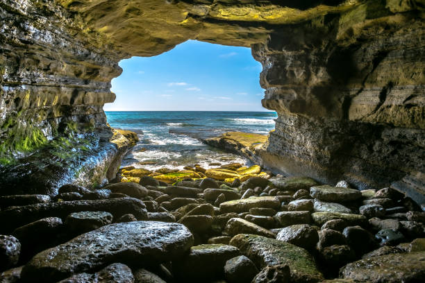 The beautiful rock cave at the sea in La Jolla California The beautiful rock cave at the sea in La Jolla California. The beautiful rock cave at the sea from the inside of the cave at mid day. la jolla stock pictures, royalty-free photos & images
