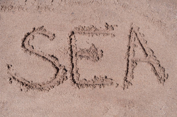 istock Stars of pin code drawn on brown sand on the beach in sunny day 827146062