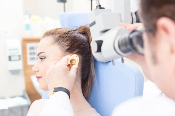 istock Doctor Doing Ear Exam With Otoscope 827155198